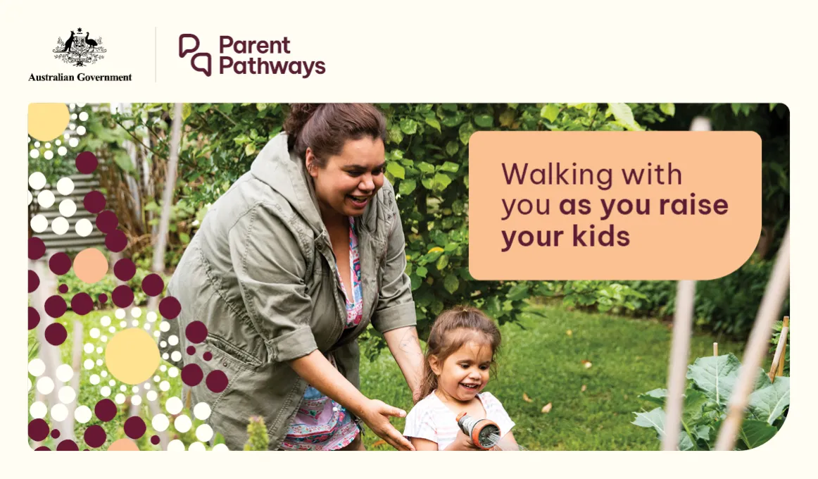 A lady helps a child move along