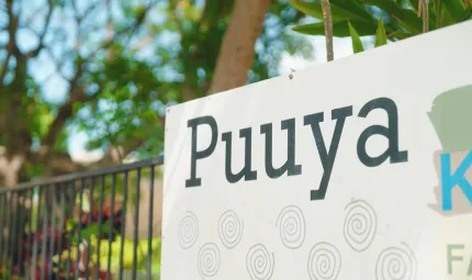 A sign showing the Puuya Foundation's logo