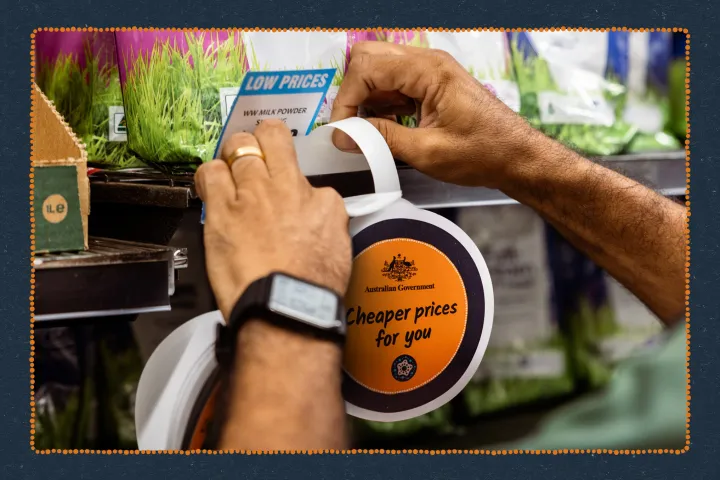 Hands putting a Cheaper prices for you wobbly sign on a store shelf