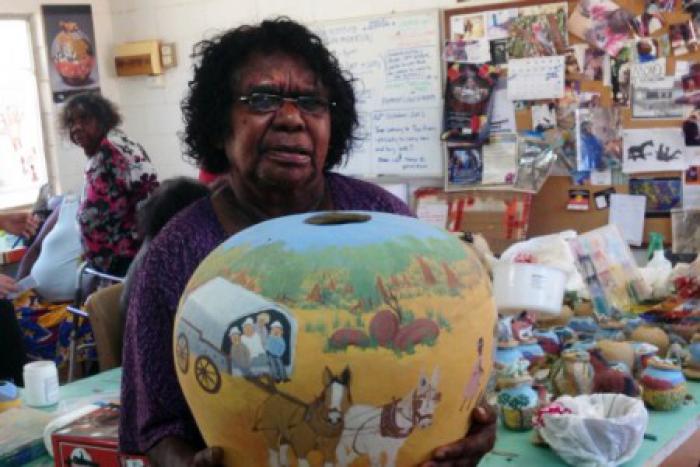 Judith Inkamala displays her latest work of pottery.  