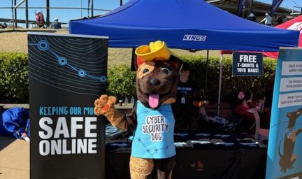 Cyber Security Dog outside his display tent